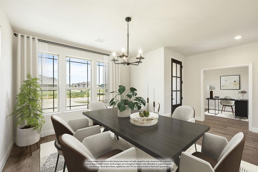 Dining room with dark wood table, eight chairs, chandelier, and large windows with natural light