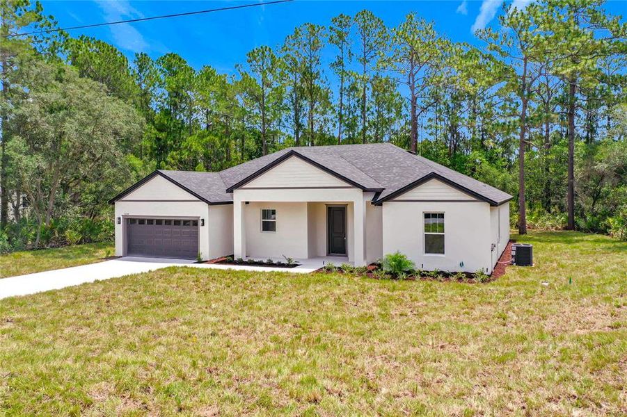 Front exterior of a new home in , Eustis, FL, highlighting curb appeal (Image 24). Front exterior of a new home in , Eustis, FL, highlighting curb appeal (Image 24).