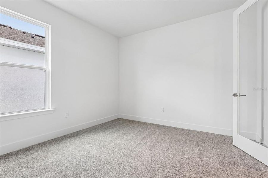 Spacious, unfurnished interior of a new home in Lakeside at Satilla, St. Cloud (Image 22).