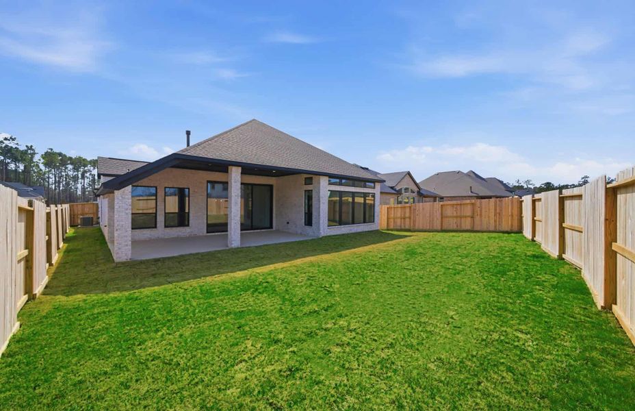 Exterior details and patio area of a home in The Highlands 55′, Porter (Image 25).