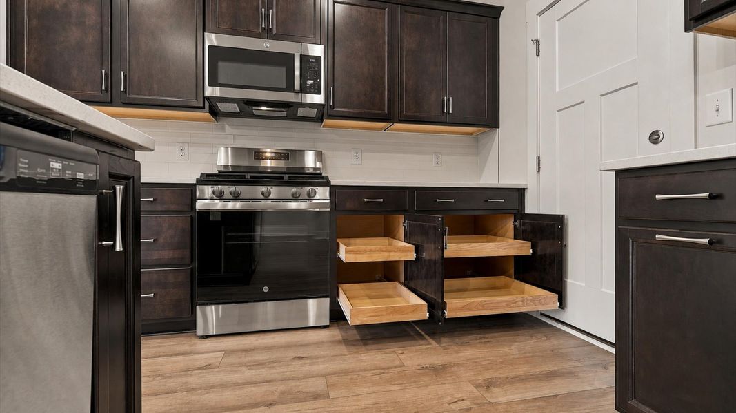 Bright and welcoming kitchen with carefully selected finishes and ample storage located near Lake Hartwell
