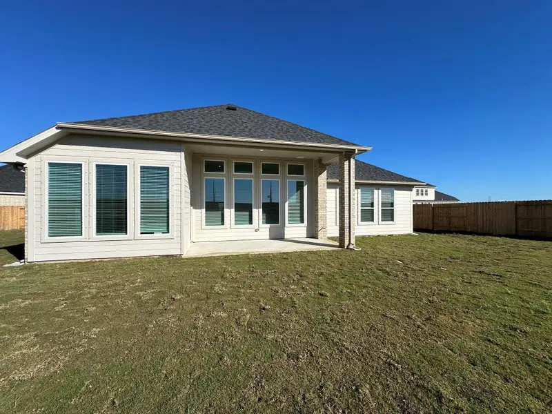 Exterior details and patio area of a home in , Iowa Colony (Image 3).
