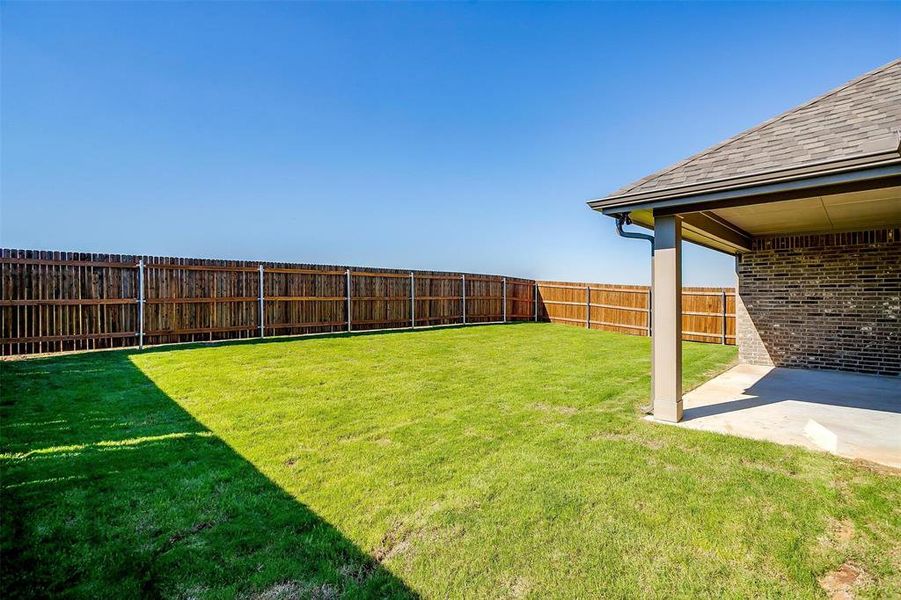 View of yard with a patio area