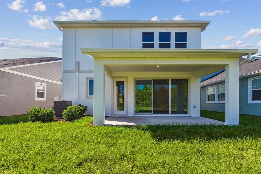Exterior details and patio area of a home in Chapel Crossings - Garden Series, Wesley Chapel (Image 22).