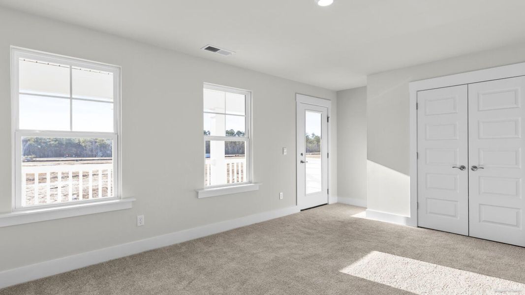 Representative unfurnished interior of a home built from the Harbor Oak by D.R. Horton in The Grove at Blake Farm, Wilmington (Image 51).