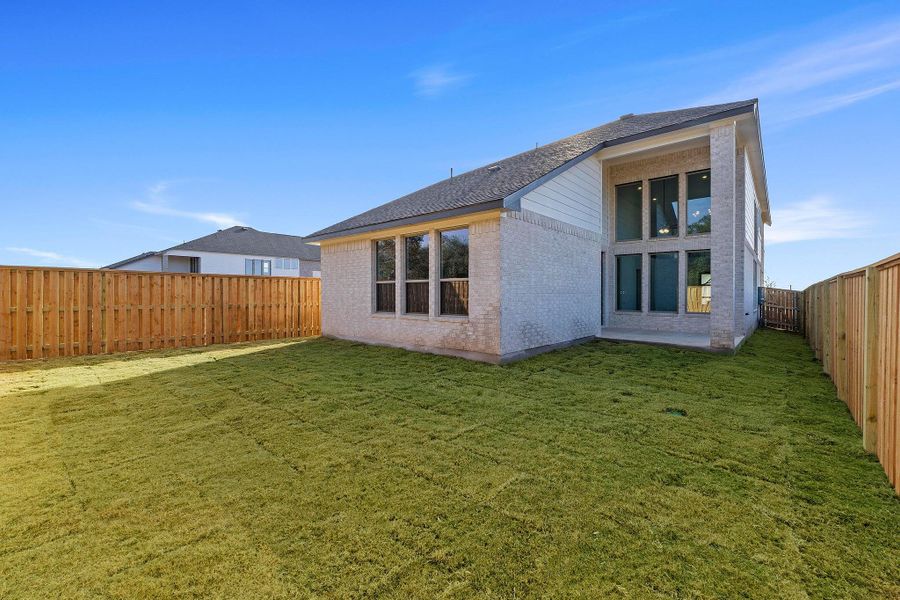 Exterior details and patio area of a home in Parmer Ranch, Georgetown (Image 22).