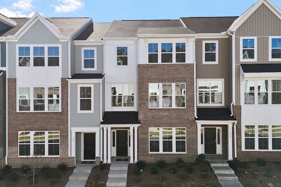 Front exterior of a new home in Renaissance at White Oak, Garner, NC, highlighting curb appeal (Image 1).