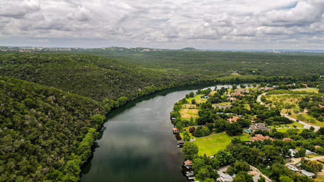 Breathtaking Austin Lake. It tranquilly winds through verdant hillsides, featuring waterside homes and abundant natural beauty. Breathtaking Austin Lake. It tranquilly winds through verdant hillsides, featuring waterside homes and abundant natural beauty.