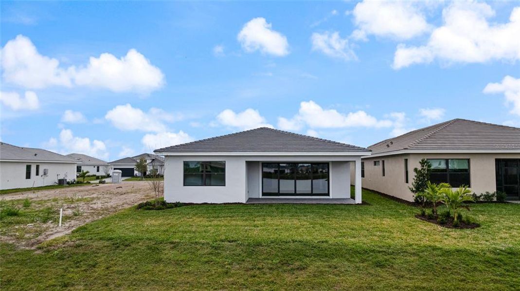 Exterior details and patio area of a home in Cresswind Lakewood Ranch, Lakewood Ranch (Image 25).