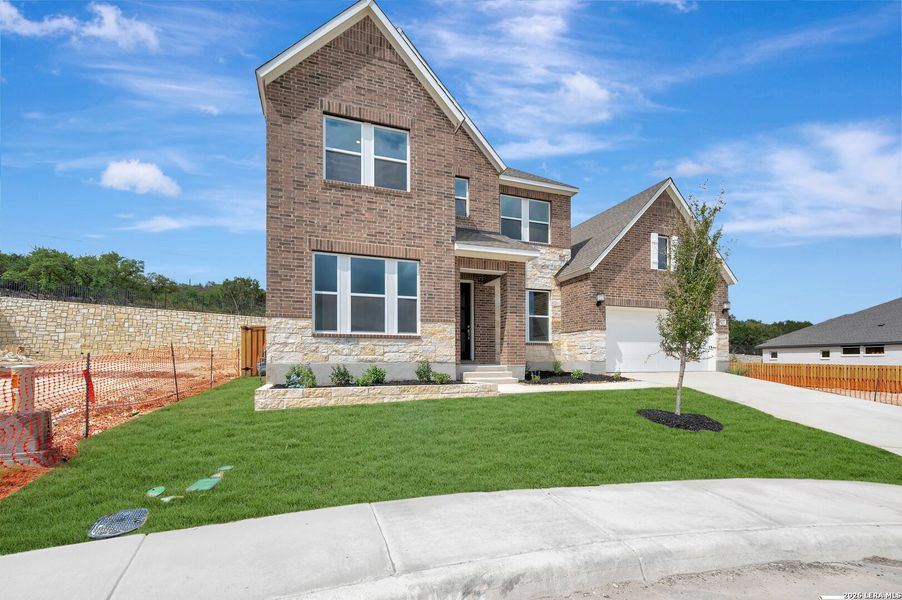Front exterior of a new home in Windsong - Legacy Series, Boerne, TX, highlighting curb appeal (Image 25).
