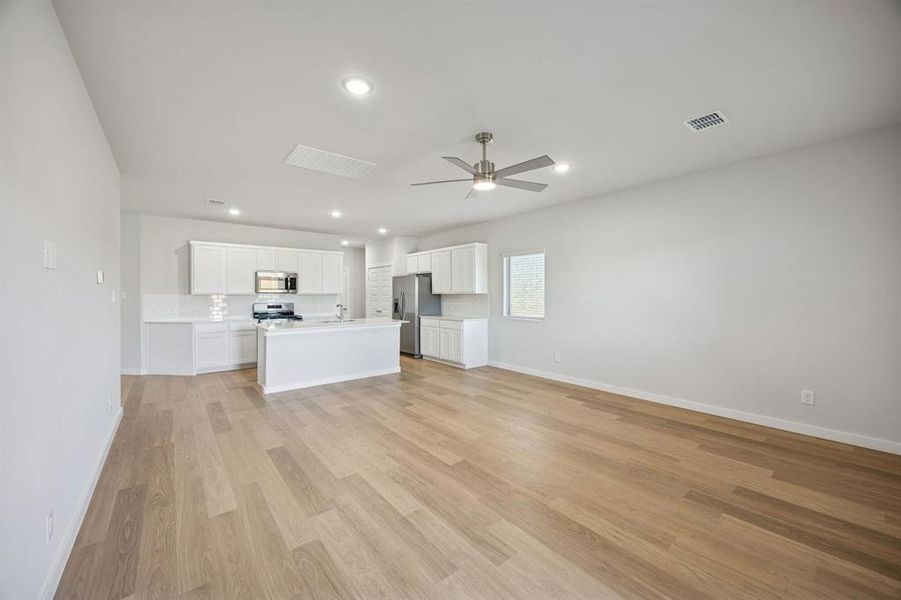 Living Room in the Oak II home plan by Trophy Signature Homes – REPRESENTATIVE PHOTO