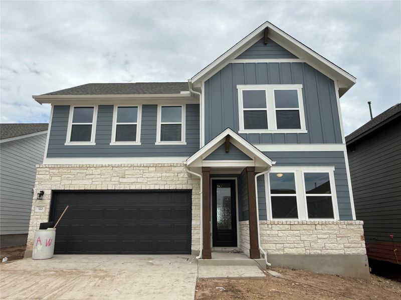 Front exterior of a new home in Cannon Ranch 45s, Dripping Springs, TX, highlighting curb appeal (Image 18). Front exterior of a new home in Cannon Ranch 45s, Dripping Springs, TX, highlighting curb appeal (Image 18).