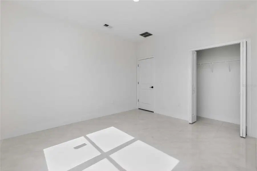 Spacious, unfurnished interior of a new home in , Port Charlotte (Image 48).