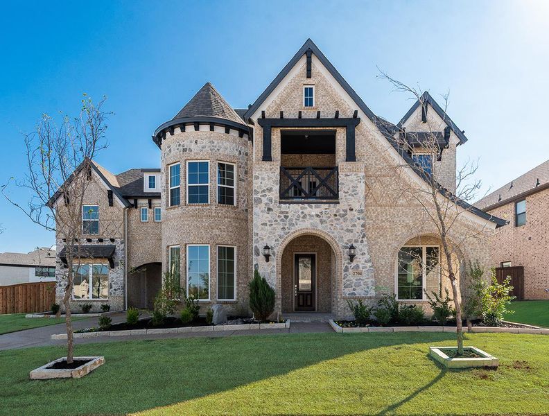Front exterior of a new home in South Pointe, Mansfield, TX, highlighting curb appeal (Image 1).