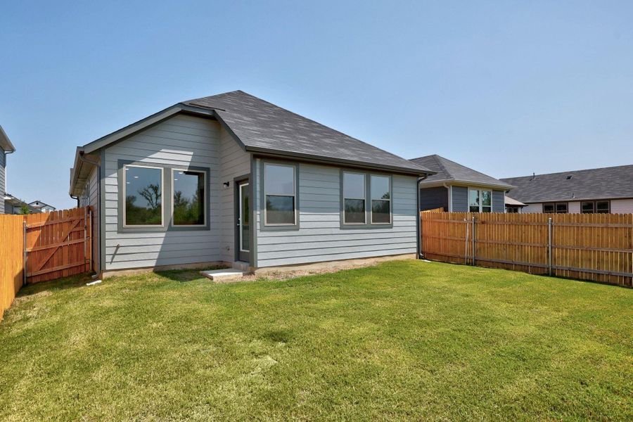 Exterior details and patio area of a home in Trinity Ranch, Elgin (Image 2). Exterior details and patio area of a home in Trinity Ranch, Elgin (Image 2).