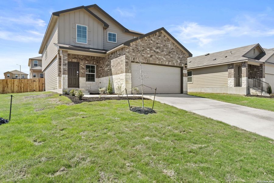 Front exterior of a new home in Laurel Vistas, San Antonio, TX, highlighting curb appeal (Image 1). Front exterior of a new home in Laurel Vistas, San Antonio, TX, highlighting curb appeal (Image 1).