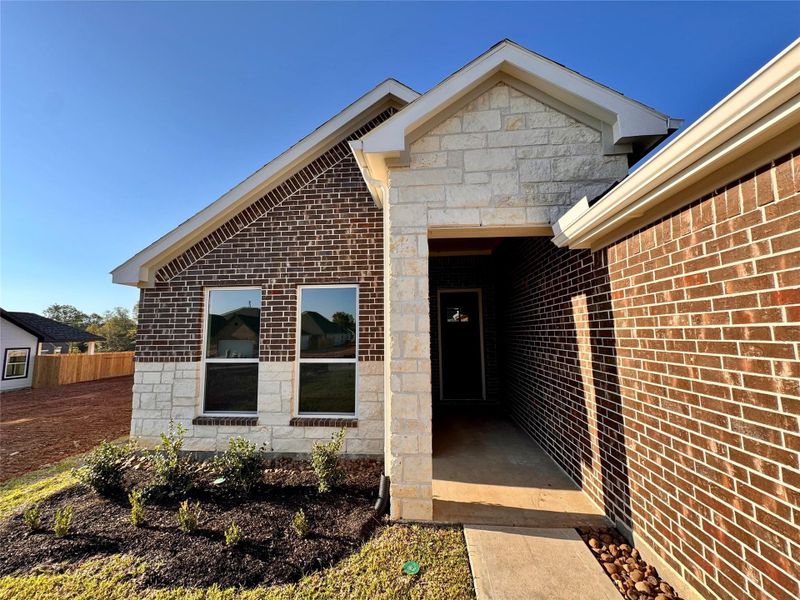Exterior details and patio area of a home in Lexington Heights, Willis (Image 3). Exterior details and patio area of a home in Lexington Heights, Willis (Image 3).