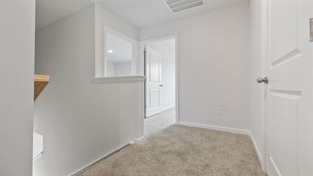 Spacious, unfurnished interior of a new home in Bentley Park, Greenwood (Image 22).