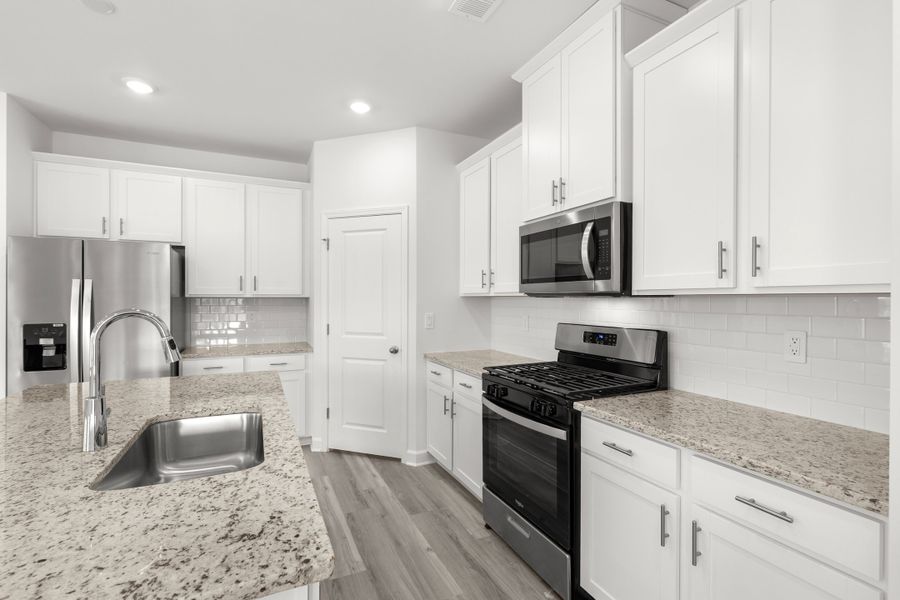 Furnished interior view inside a new home in Waterside - Boardwalk Series, Longs (Image 5).
