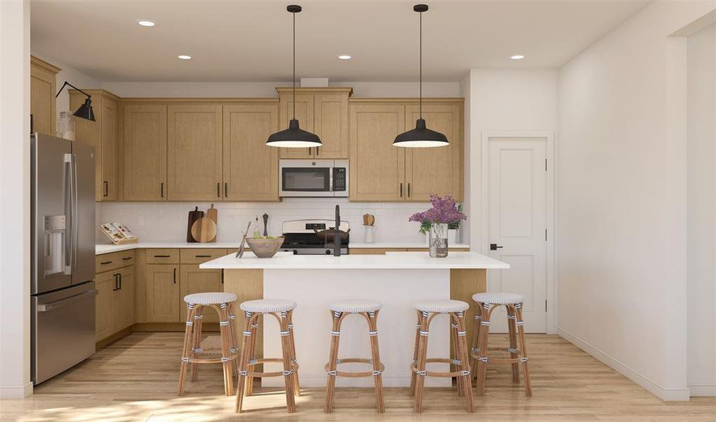 Lovely kitchen with quartz countertops and maple cabinets (*Photo not of actual home and used for illustration purposes only.)