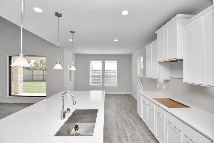 This generously spacious kitchen is a dream realized! Sample photo of completed home with similar floor plan. Actual colors and selections may vary.