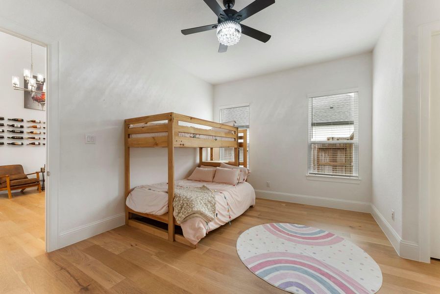 Guest bedroom includes a beautifully appointed en suite bathroom.