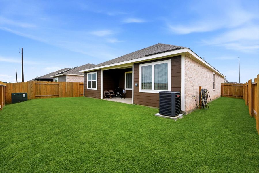 Exterior details and patio area of a home in Vacek Country Meadows, Richmond (Image 27).