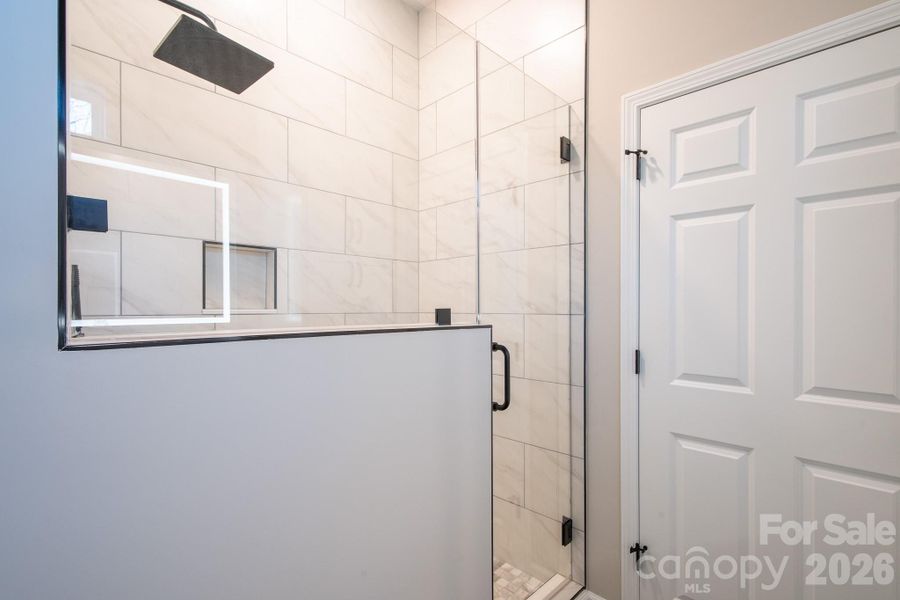 Walk-in tile shower with rainfall shower head