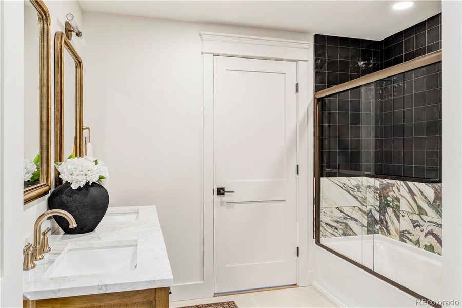 Thoughtfully designed bathrooms with champagne bronze finishes