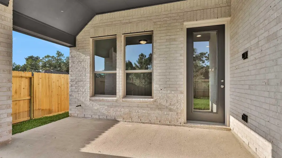 Exterior details and patio area of a home in The Woodlands Hills 40', Willis (Image 3). Exterior details and patio area of a home in The Woodlands Hills 40', Willis (Image 3).