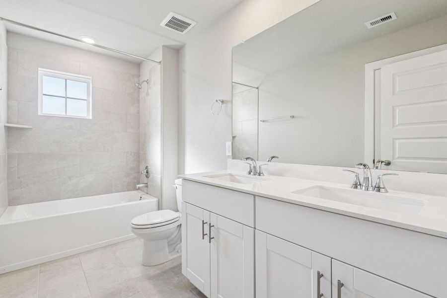 Furnished interior view inside a new home in Massey Oaks - Premier Series, Pearland (Image 10). Furnished interior view inside a new home in Massey Oaks - Premier Series, Pearland (Image 10).