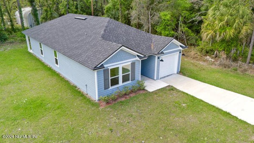 Front exterior of a new home in , Satsuma, FL, highlighting curb appeal (Image 24).