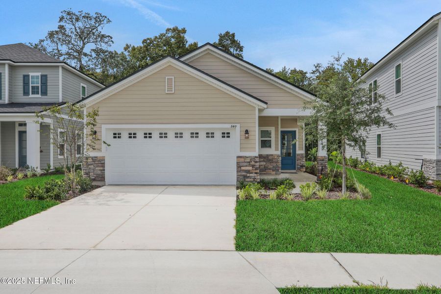 Front exterior of a new home in TrailMark, St. Augustine, FL, highlighting curb appeal (Image 2). Front exterior of a new home in TrailMark, St. Augustine, FL, highlighting curb appeal (Image 2).