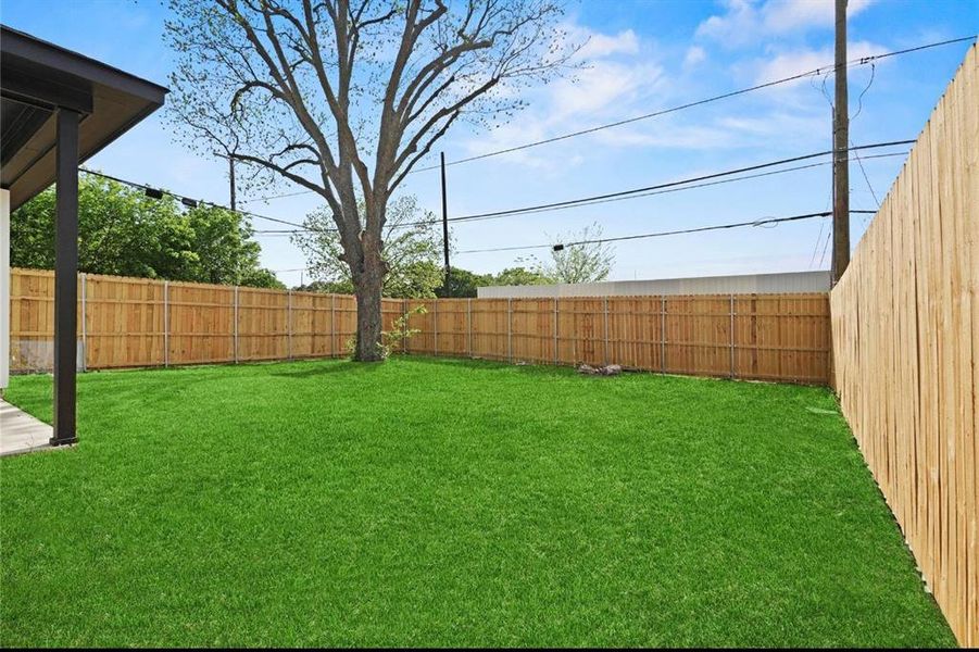View of fenced backyard