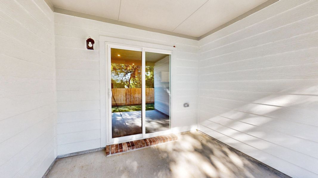 A hallway with a glass door. A hallway with a glass door.