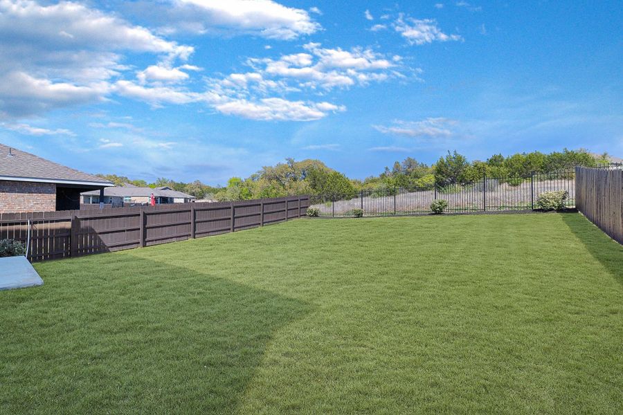 View of fenced backyard