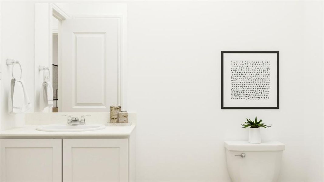 Bathroom featuring vanity and toilet