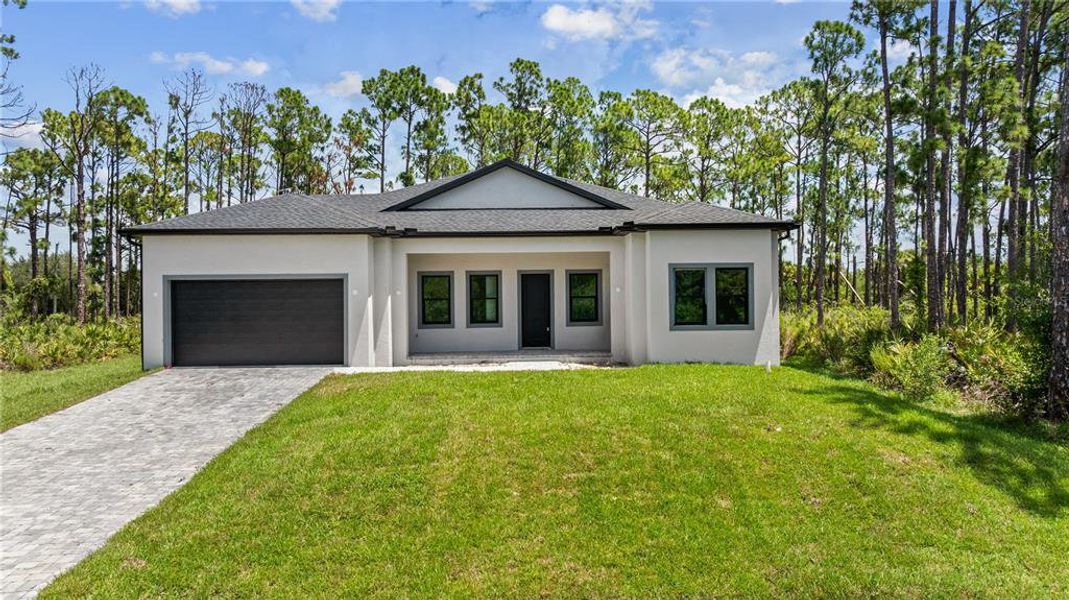 Front exterior of a new home in , Port Charlotte, FL, highlighting curb appeal (Image 29). Front exterior of a new home in , Port Charlotte, FL, highlighting curb appeal (Image 29).