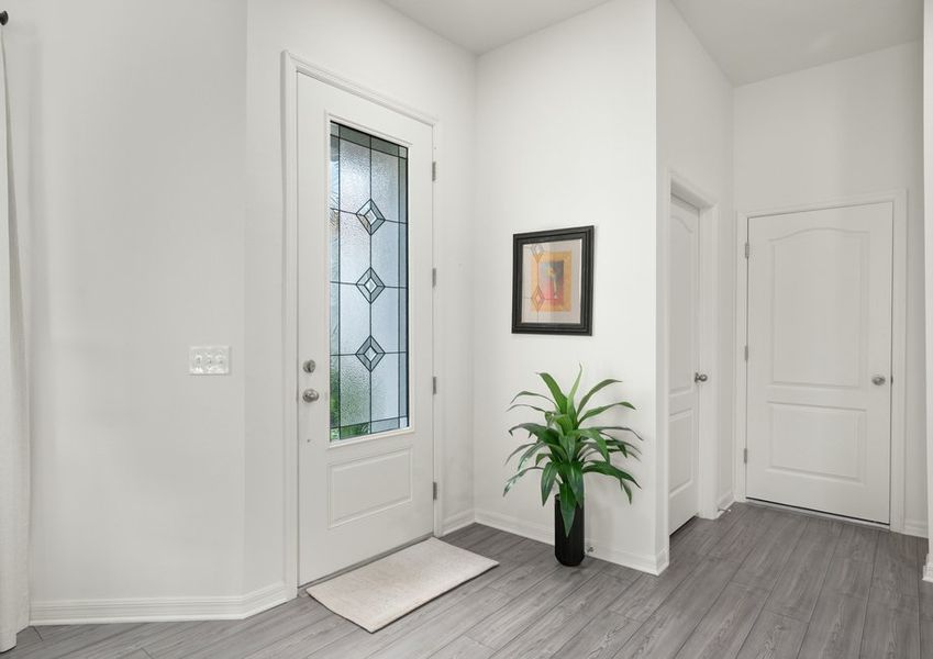 The entryway is highlighted by this gorgeous 3/4 lite door!