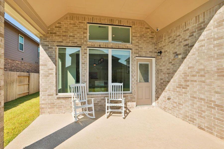 Step outside and relax on the coveredback patio, the perfect spot for outdoordining or relaxing, rain or shine. Step outside and relax on the coveredback patio, the perfect spot for outdoordining or relaxing, rain or shine.