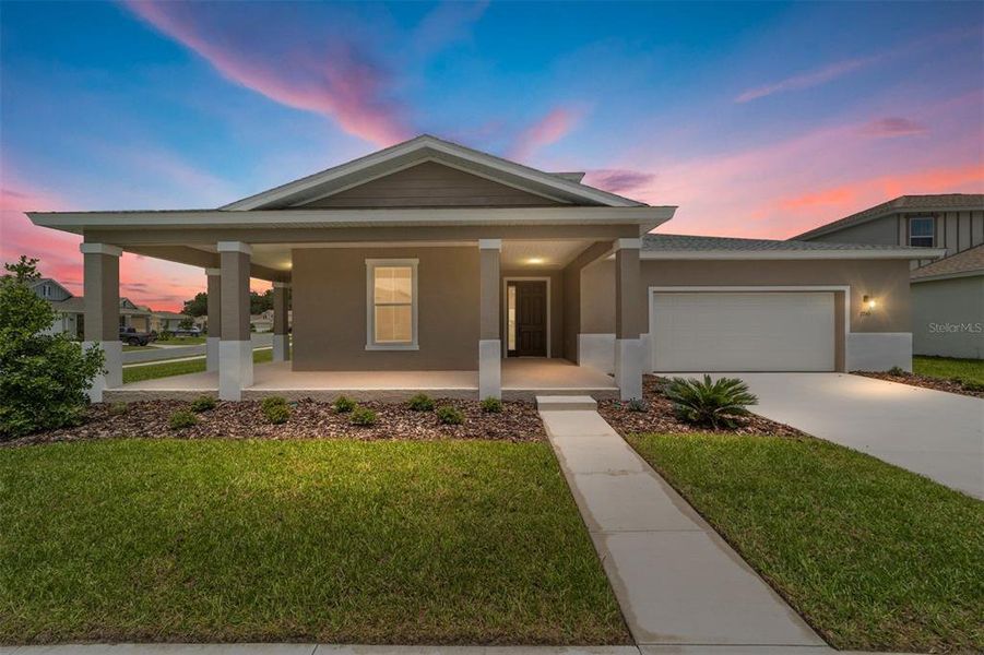Front exterior of a new home in Calesa Township, Ocala, FL, highlighting curb appeal (Image 1). Front exterior of a new home in Calesa Township, Ocala, FL, highlighting curb appeal (Image 1).