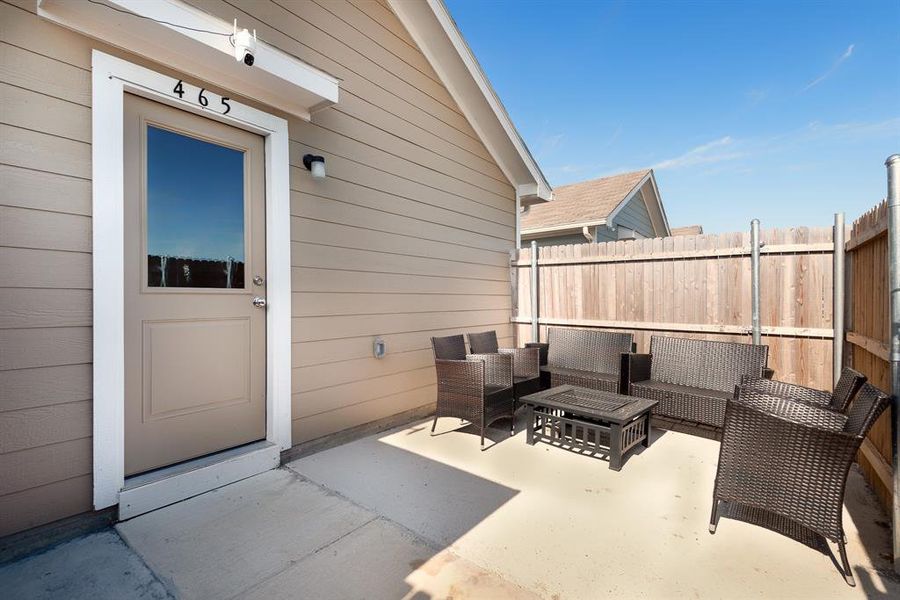 View of patio with an outdoor hangout area