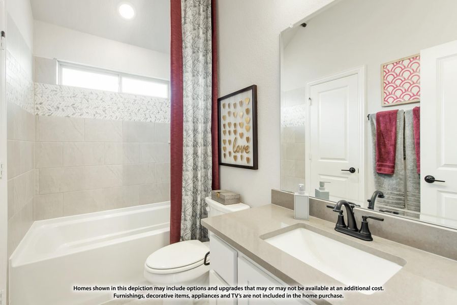 Bathroom with tiled tub-shower combo, single vanity with dark faucet, and large mirror