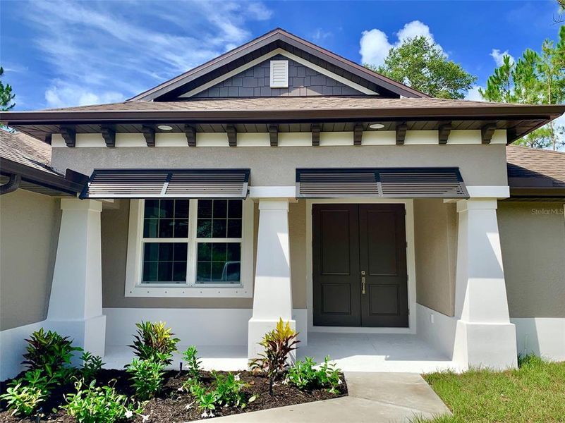 Front exterior of a new home in , North Port, FL, highlighting curb appeal (Image 25). Front exterior of a new home in , North Port, FL, highlighting curb appeal (Image 25).