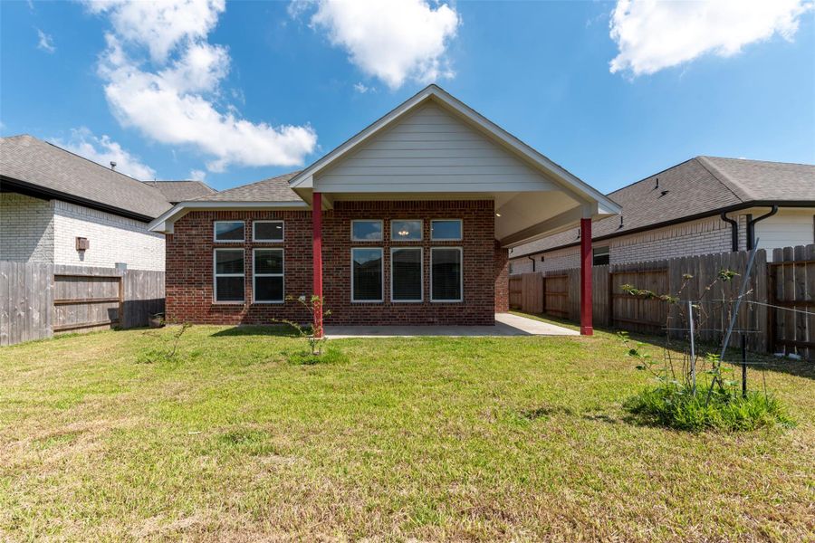 Exterior details and patio area of a home in Sunterra, Katy (Image 4).