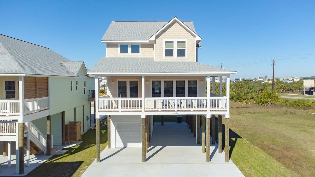 Front exterior of a new home in , Galveston, TX, highlighting curb appeal (Image 21).