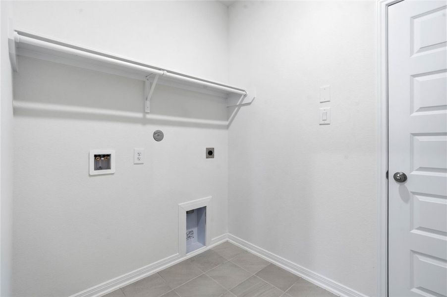 This dedicated laundry space is designed for maximum efficiency and ease of use, providing a clean, organized environment for daily household tasks. Its streamlined layout and neutral finishes make it a versatile asset that integrates seamlessly into the home’s overall design. This dedicated laundry space is designed for maximum efficiency and ease of use, providing a clean, organized environment for daily household tasks. Its streamlined layout and neutral finishes make it a versatile asset that integrates seamlessly into the home’s overall design.