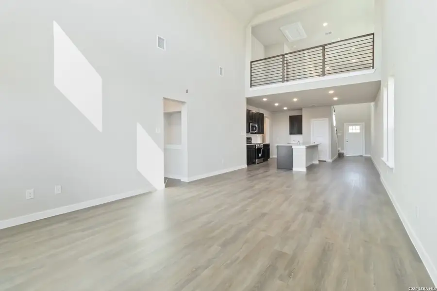 Spacious, unfurnished interior of a new home in Hunters Ranch, San Antonio (Image 17).