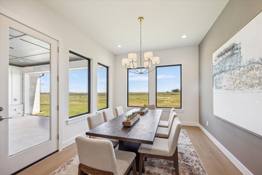 Dining Area has views of the Backyard and access to Back Porch - perfect for Indoor/Outdoor Entertaining. Dining Area has views of the Backyard and access to Back Porch - perfect for Indoor/Outdoor Entertaining.