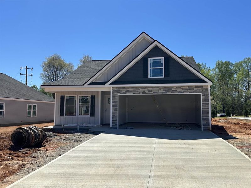 Front exterior of a new home in Stones Throw, Inman, SC, highlighting curb appeal (Image 1). Front exterior of a new home in Stones Throw, Inman, SC, highlighting curb appeal (Image 1).